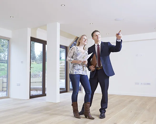 An agent talking to a young couple